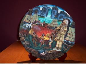 Circular Plate showing leader watching his community celebrating. Issued by Midori Mint, Limited Edition