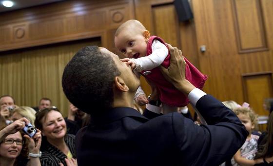 President Obama lifts a baby during his recent trip to Europe. President Obama lifts a baby during his recent trip to Europe. White House Photo, by Pete Souza