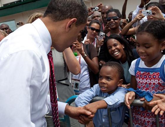 The President greets people at the Port of Spain airport before departing for Washington, D.C. on April 19, 2009. The President greets people at the Port of Spain airport before departing for Washington, D.C. on April 19, 2009. White House Photo, Pete Souza
