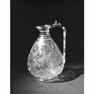 This rock crystal ewer exhibited at the Victoria and Albert Museum in London, UK,  is one of a series that survives in collections across Europe. Such high-quality rock crystal vessels were made for the rulers of Cairo during the Fatimid period (969-1171). This is confirmed by inscriptions on several of them which name specific rulers. Great skill was required to hollow out the raw rock crystal without breaking it and to carve the delicate, often very shallow, decoration. 