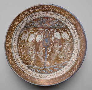 Bowl Of Reflections Beginning in the twelfth century, ceramics were produced in Iran with a frit body that provided a clean, light surface for painting. The most luxurious of these wares contained luster, added to the surface in a second firing and creating a metallic sheen that complemented mystical texts and images. While the image on this dish does not appear to be narrative, the presence of a bird, a familiar theme in Persian mystical literature, and certain human features associated with light (such as the figures’ moon-shaped faces) set the tone for the mystical verses appearing in two bands around the rim and interior. The text includes poetry by Rumi’s spiritual master, Shams al- Din Tabrizi (d. 1248), as well as verses believed to have been composed by the lesser-known Baba Afzal al-Din Kashani (d. 1213–14).
