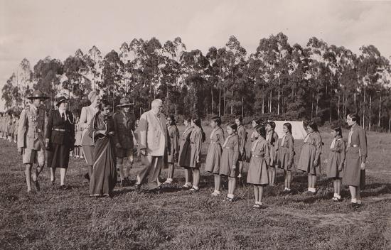 His Highness the Aga Khan III inspecting girl guides at a rally in Nairobi 1945