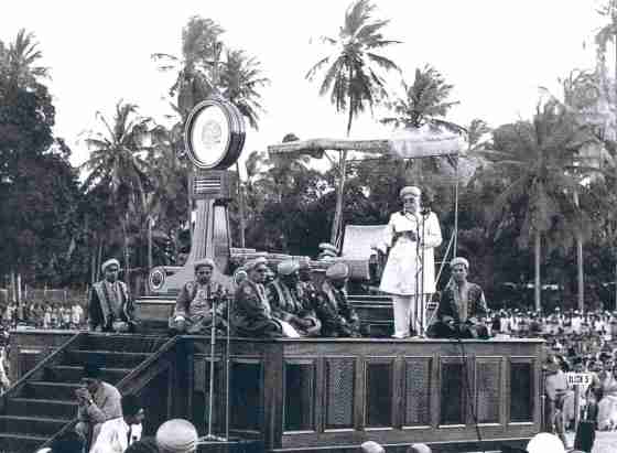 August 10, 1946: The Aga Khan speaking at the Diamond Jubilee Celebrations in Dar-es-Salaam, home of 74,000 Africans, Indians, Arabs, and Europeans. The city was taxed by the crowd of visitors. To house them, sackcloth huts were thrown up below the coconut palms. Streets became so congested that automobile traffic was limited. Merchants enjoyed a sales boom.