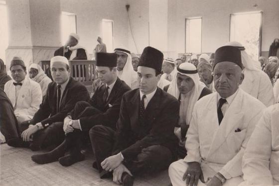 Aga Khan III HI PS PA seated in mosque