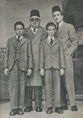 The Aga Khan pictured with his son, Prince Sadruddin, and grandsons Prince Karim (left) and Prince Amyn