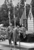 Prince Karim Aga Khan, seated on throne, during installation ceremonies of Aga Khan IV, being presented with signet ring
