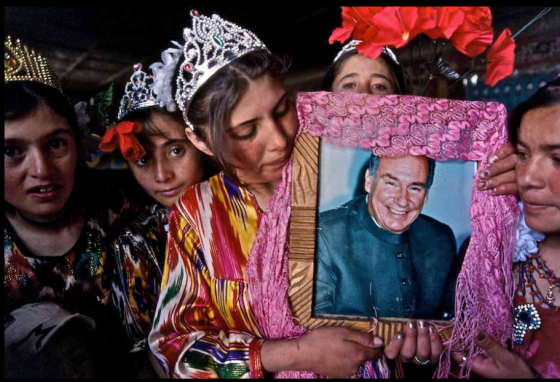Ismaili girls in Central Asia proudly and lovingly display a decorated frame holding a photo of their beloved 49th Imam, His Highness the Aga Khan. Please click for enlargement. Photo: Matthieu Paley. Copyright.  