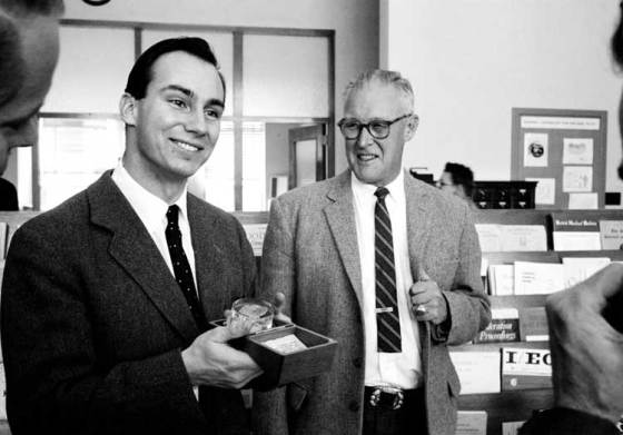 The Aga Khan, seen with Dr. Thomas Shipman, showing immense delight of gift of trinite presented to him during his visit to the Health Research Laboratory in Las Alamos, California, in November 1959
