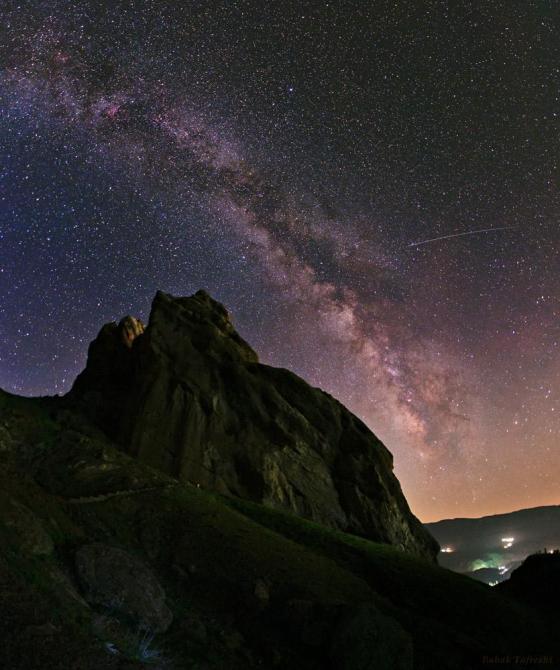 The arc of the Milky Way hangs over the imposing mountain fortress of Alamut in this starry scene. Photo: Babak Tafreshi. Copyright.