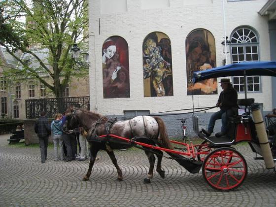 Exploring Bruges by horse and carriage.