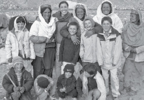 Grandmothers and grandchildren reunited when the older women return from the the pamir (high pastures). Photo: Pam Henson. Copyright.