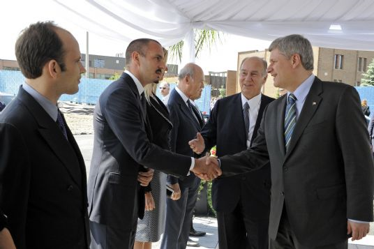 His Highness the Aga Khan presents Prince Rahim Aga Khan to Canadian Prime Minister Stephen Harper at the Foundation Ceremony of the Aga Khan Museum and the Ismaili Centre being constructed in Toronto. Photo: Gary Otte. Aha Khan Development Network.