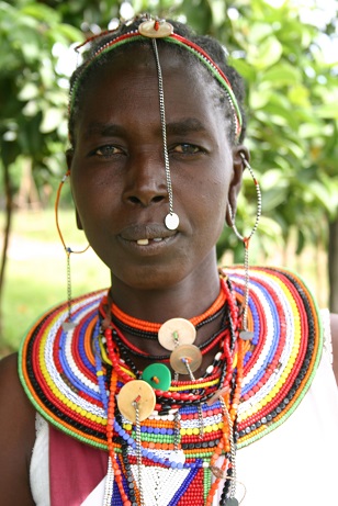 A Kenyan Maasai woman’s pride, the emankeeki, neck-to-chest body décor in patterned beads . Photo: Shana Greene, http://www.villagevolunteers.org. Copyright.
