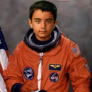 Qayl dressed as an astronaut. Please click on photo to read Qayl's photo essay.