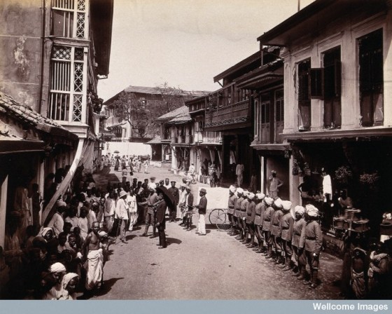 A group of officials making a visit to a house in Bombay, suspected of holding people with plague. Phto Credit: Wellcome Library, London. Wellcome Images