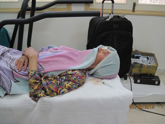 An elderly lady patiently awaits her turn for the surgery to remove cataracts. Photo: Badrudin Kurwa. Copyright.