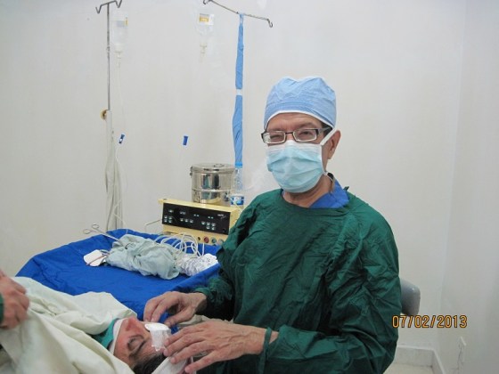 'Blind today seeing tomorrow' - Dr. Kurwa working on one of his patients. He performed 98 surgeries on individuals blinded by cataracts. Photo: Badrudin Kurwa Collection. Copyright.