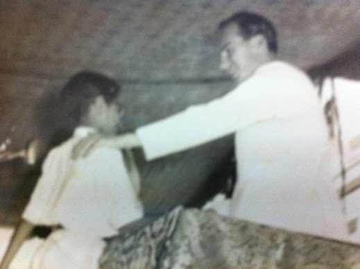 Badrudin Kurwa, at age 12, being awarded a prize by Mawlana Hazar Imam for standing first. Photo: Badrudin Kurwa Collection.