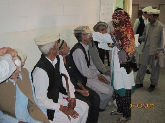One of the two wonderful technicians who assisted Dr. Kurwa. is seen examining patients at the clinic. Photo: Badrudin Kurwa. Copyright.