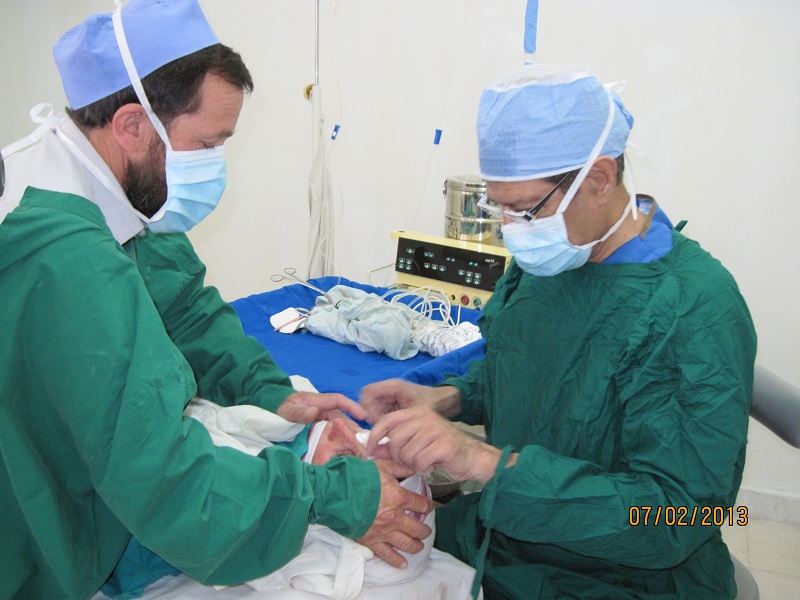 Badrudin Kurwa, right, performing a cataract surgery in Chitral, Pakistan. Please click on image to read article.
