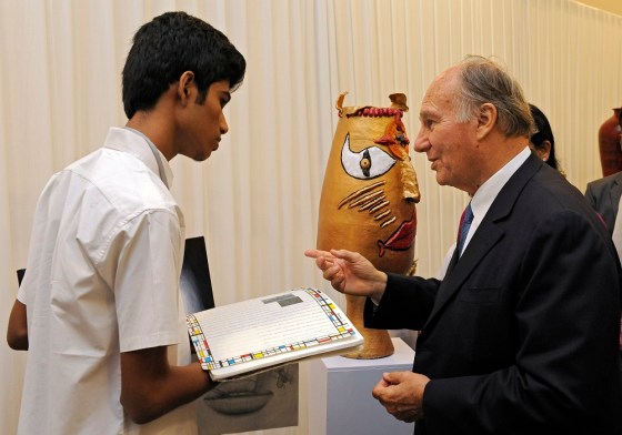 His Highness the Aga Khan asks a student at the Aga Khan Academy, Hyderabad about his work. - Photo: AKDN/Gary Otte.