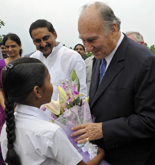 A young girl presents Mawlana Hazar Imam with flowers on the occasion of the inauguration of the Aga Khan Academy, Hyderabad. Photo: The Ismaili/Gary Otte.