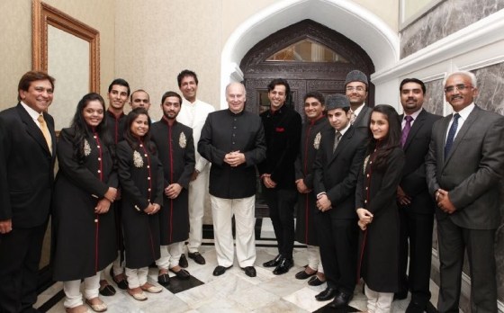 Mawlana Hazar Imam poses for a photograph with the performers at the conclusion of the institutional dinner. Photo: The Ismaili/Aziz Ajaney.