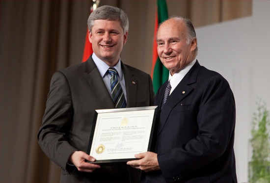 On June 19, 2009, the House of Commons voted unanimously to bestow Honorary Canadian citizenship on his Highness the Aga Khan. Prime Minister Stephen Harper is seen here presenting the Ismaili Imam with the Citizenship during the foundation ceremony in Toronto of the Aga Khan Museum, the Ismaili Centre and their Park. Photo: The website of the Prime Minister of Canada.