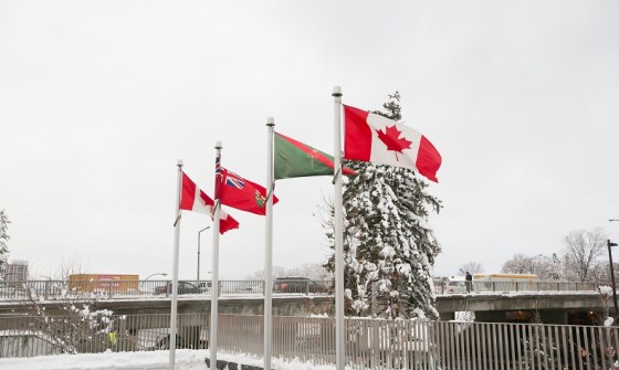 The Canadian Maple Leaf flag at either end with the flags of Ontario and the striped red and green flag of the Ismaili Imam located at the east front end of the Delegation of the Ismaili Imamat Building located on Sussex Drive in Ottawa. The RAIC presented a gold medal to His Highness the Aga Khan for his significant contribution to Canadian architecture. Iconic Ismaili Imamat buildings in Canada include the Delegation Building (Ottawa, 2008), the Ismaili Centre (Burnaby, 1985), the Aga Khan Museum, the Ismaili Centre and their Park (all in Toronto, expected to open in 2014), and the public parks in Edmonton and Vancouver (both forthcoming). In addition, the old War Museum on Sussex Drive in Ottawa will host the Centre of Pluralism. The Ismaili community has other fine houses of worship known as Jamatkhanas in many cities and town across Canada. Photo: © AKDN/Mo Govindji.