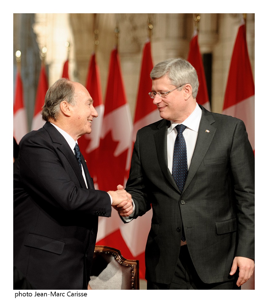 His Highness the Aga Khan and Prime Minister Stephen Harper congratulate each other after signing a Protocol of Understanding between the Ismaili Imamat, a 1400 year hereditary Institution, and Canada. Photo: Jean-Marc Carisse. Copyright.