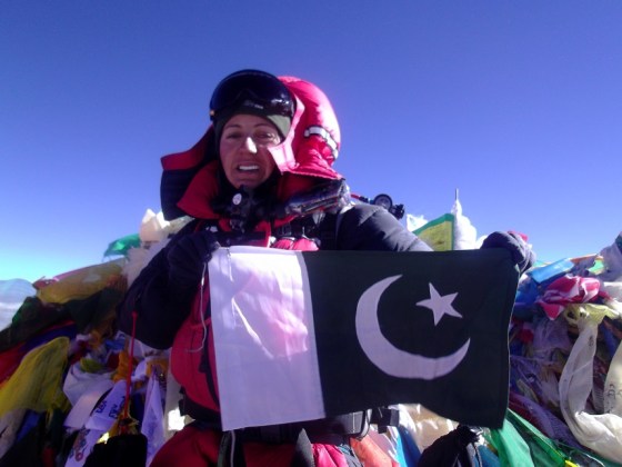 At the top - Samina Baig on Mount Everest with the flag of Pakistan. Photo: Samina Baig collection. Copyright.
