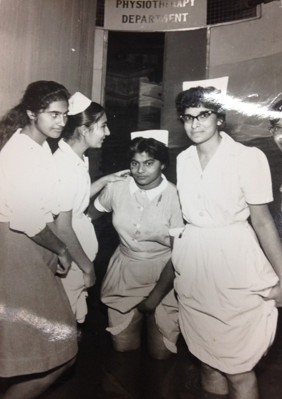 Nurses wading through water when the physiotherapy room got flooded. Photo: Kunden Paatni.