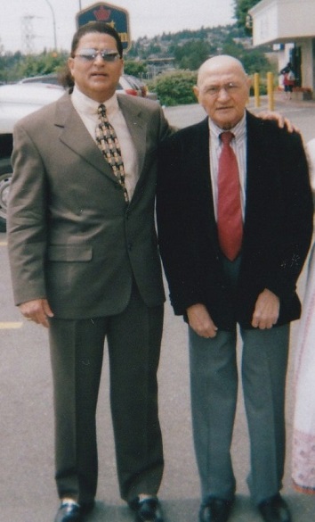 Renowned Ismaili musician and composer, Enoo, pictured with his beloved dad in 2005 before the Vancouver  mulaqat with Mawlana Hazar Imam. Photo: Enoo archives.