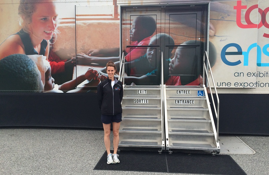 Stephanie in front of the exhibition bus. Photo: Malik Merchant