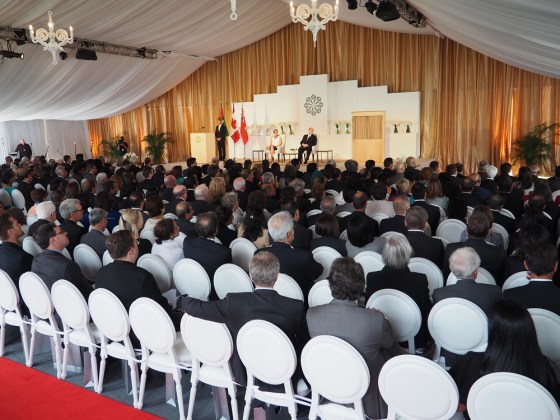 Mawlana Hazar Imam, Premier Kathleen Wynne and the reciter of the Holy Qur'an, Ahsan Afzally, look on as a translation of the Qur'anic verses in English and French is underway. Photo: Simerg/Malik Merchant. Copyright.