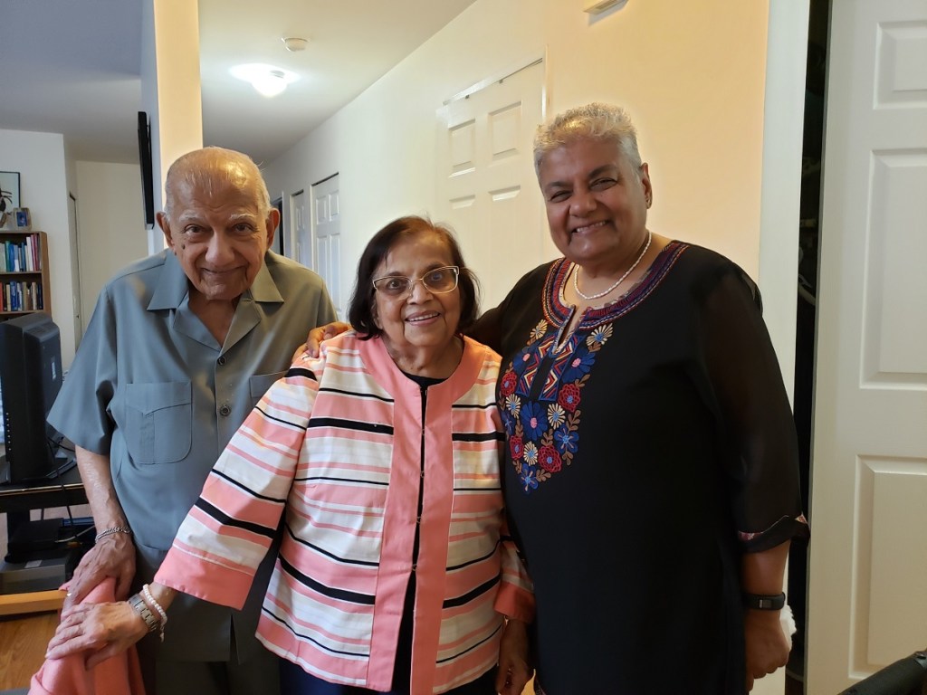 Mrs. Merchant, centre, with Abdulrahim Rajwani and his daughter Zarina