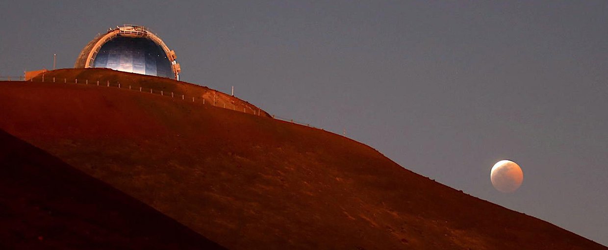 The NASA Infrared Telescope Facility telescope during a lunar eclipse