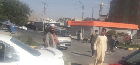 Kabul residents walking on the street at Taimany Square.