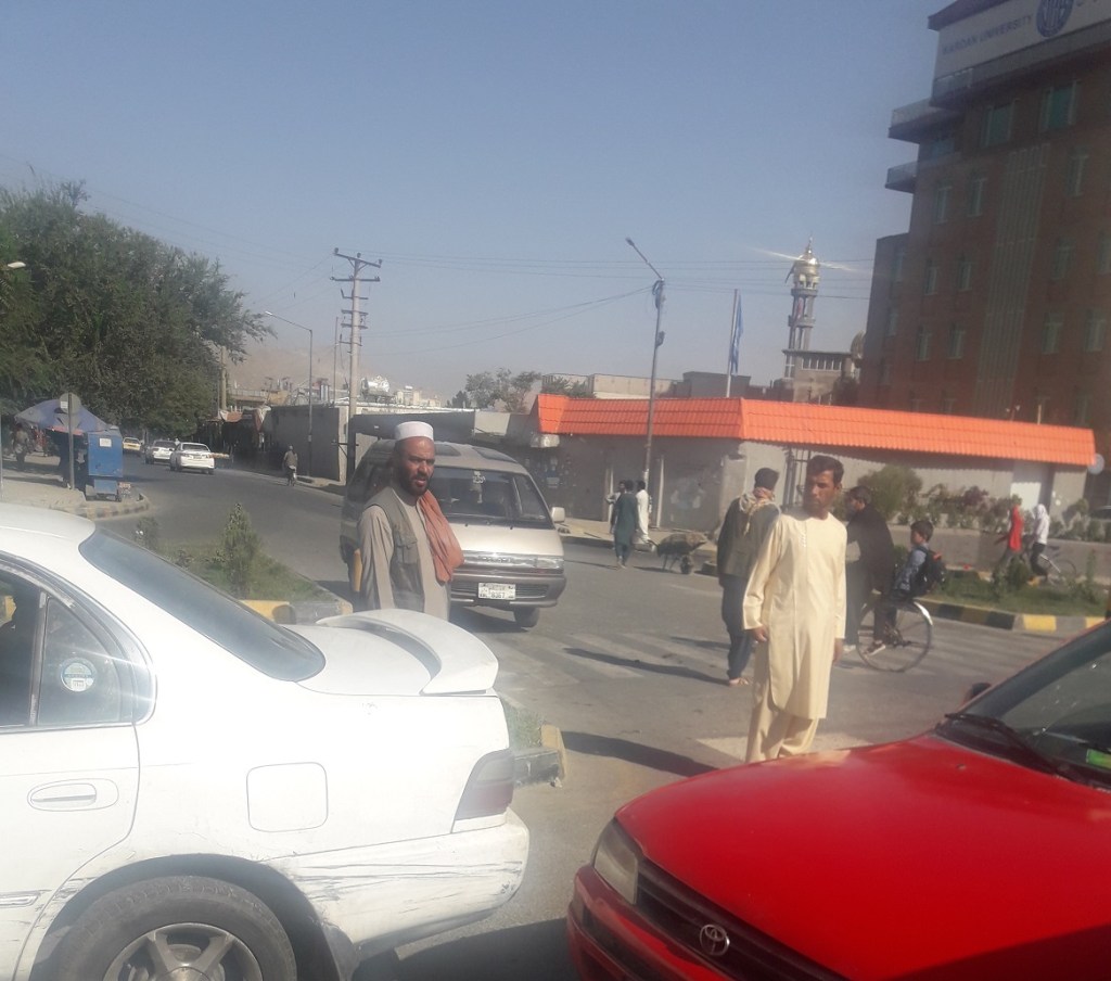 Kabul residents walking on the street at Taimany Square.