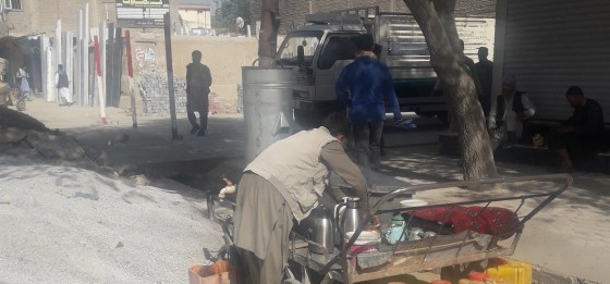 A man uses a makeshift carrier for providing tea drinking service at Kabul's Kote Sangi commercial hub sector of the city