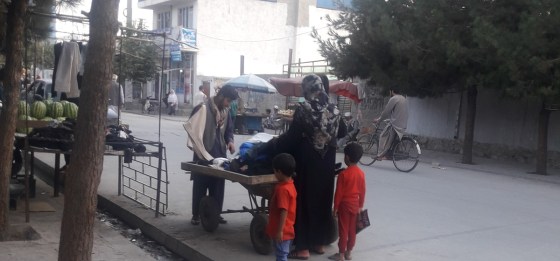 A woman shops at the Qala-e-Fathullah neighbourhood in Kabul simerg