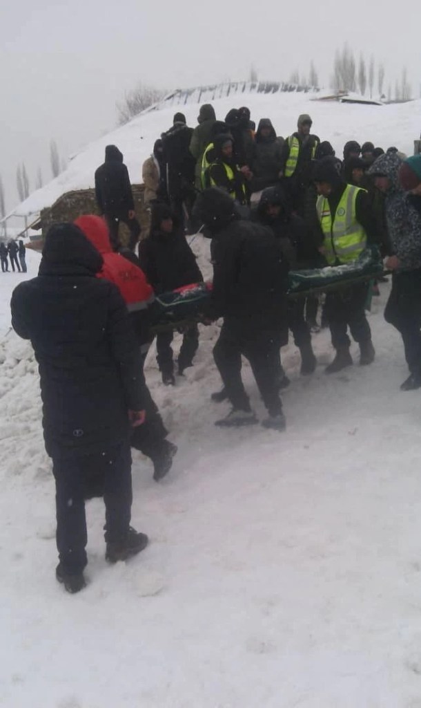 People take part in a rescue operation following an avalanche slide in Gorno-Badakhshan region, Tajikistan, February 15, 2023. Committee of Emergency Situations and Civil Defense of Tajikistan/Handout via REUTERS