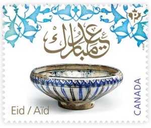 A Canadian stamp featuring a hand-painted ceramic bowl from medieval Iran, decorated with floral motifs and the calligraphy "Eid Mubarak". The stamp celebrates the Islamic holiday Eid and was issued on April 3, 2023.