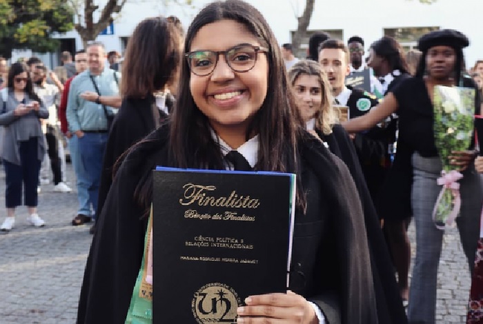 Mariana Jadaugy (d. March 28, 2023, aged 24), pictured on June 12, 2019 with her degree in Political Science and International Relations from Faculdade de Ciências Sociais e Humanas, a unit of Universidade NOVA de Lisboa. Photograph: NOVA/FCSH., Tribute simerg passings