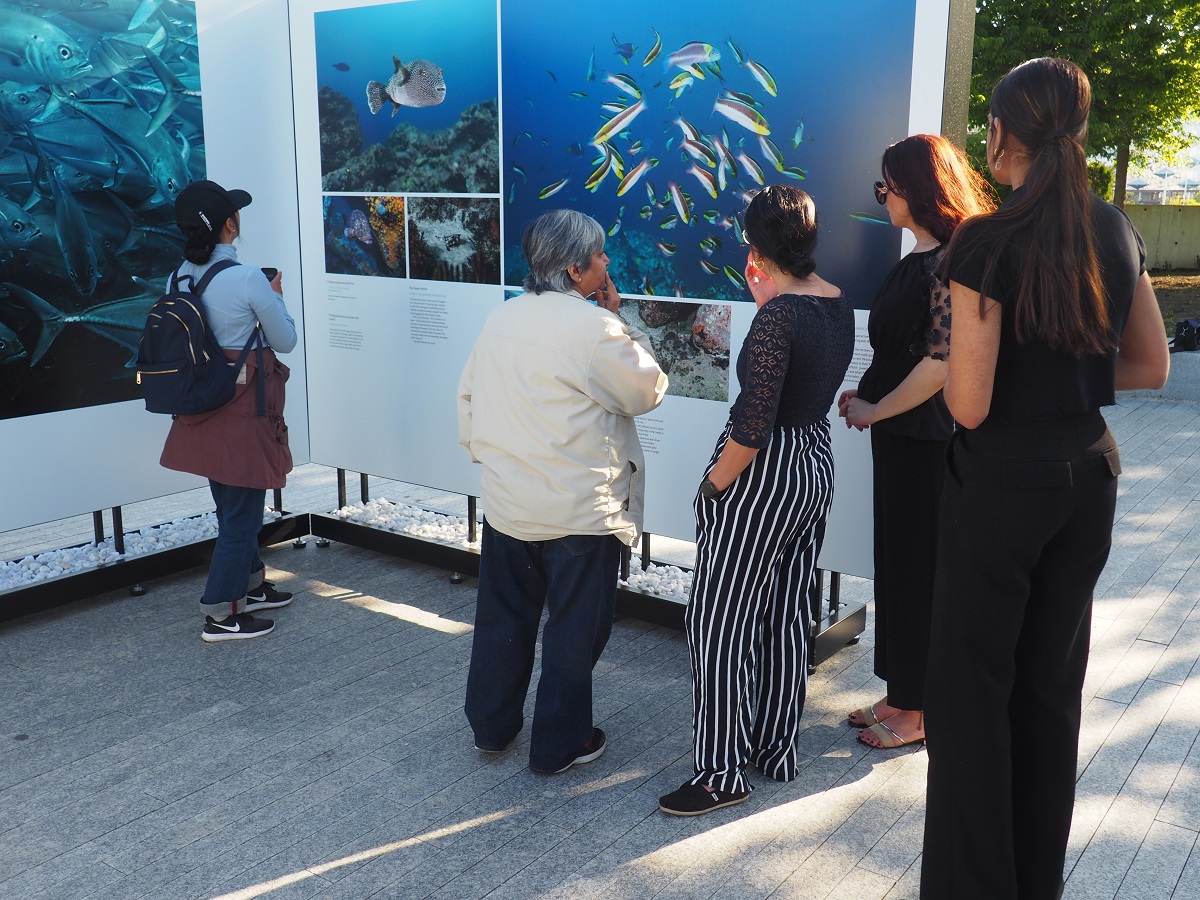 Visitors at Prince Hussain Aga Khan's exhibition The Living Sea -- Fragile Unity at the Ismaili Centre Toronto; May 26, 2023.