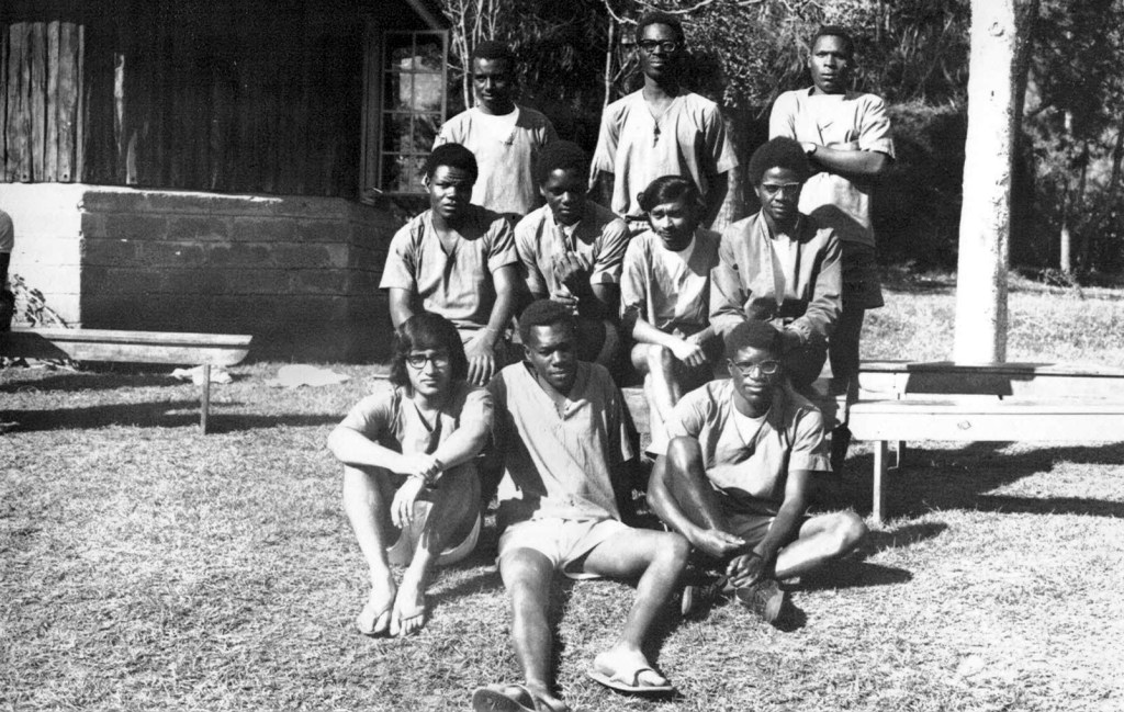 Kilimanjaro climb, Group photo of the Nelion Patrol, with Karim H. Karim sitting at the bottom left. Photograph: Karim H. Karim Collection.