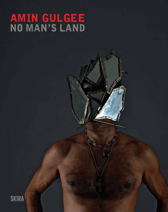 Cover of Amin Gulgee's monograph 'No Man's Land', featuring a figure with a striking, fragmented mirror mask against a dark background.
