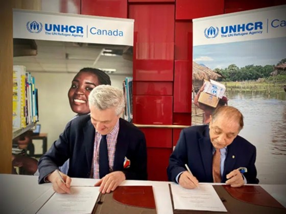 Pyarali Nanji of the Nanji Family Foundation and Filippo Grandi, UN High Commissioner for Refugees sign the grant agreement in support of Aiming Higher. 